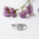 Ethically-sourced Platinum Round Brilliant Cut Diamond Halo Engagement Ring with a Cushion Shaped Head - Jeweller's Loupe