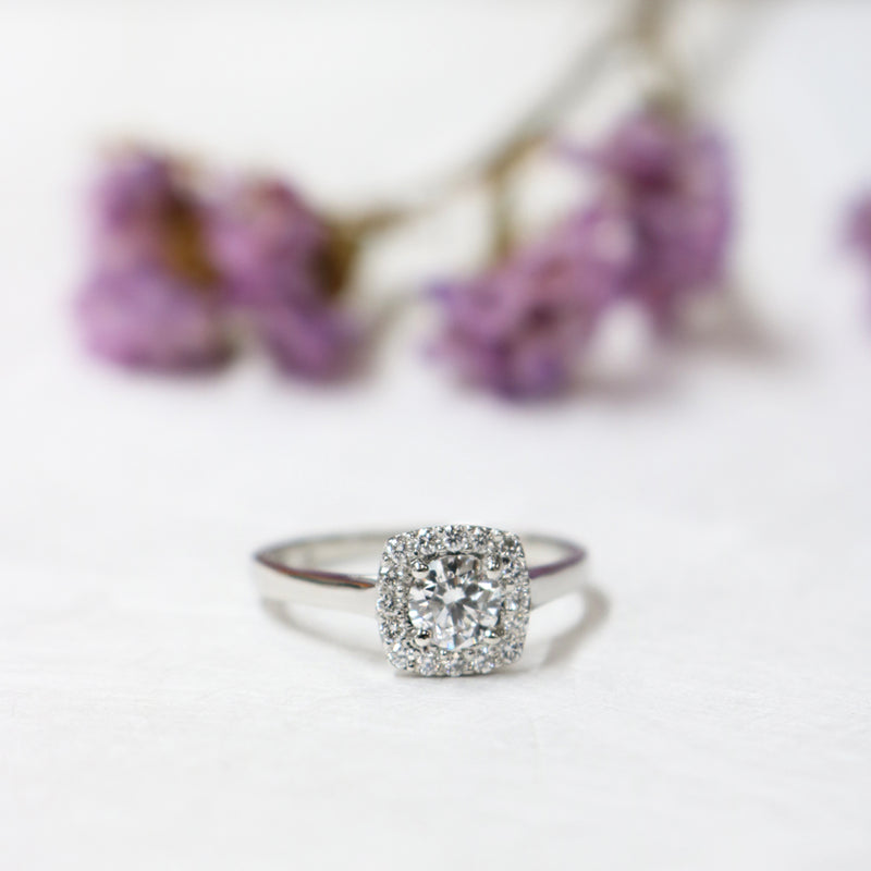 Fairtrade White Gold Round Brilliant Cut Diamond Halo Engagement Ring with a Cushion Shaped Head